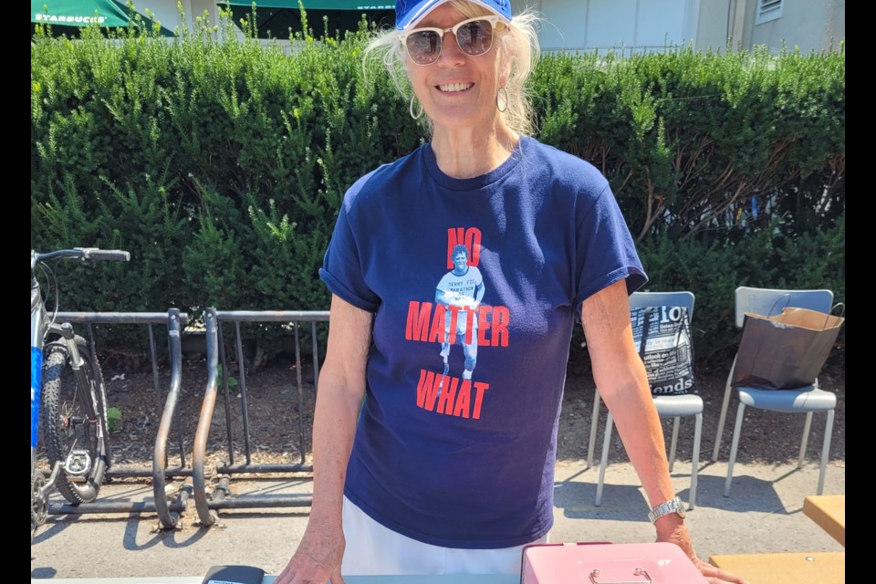 Joan King, selling T-shirts to raise money for the Terry Fox Foundation, as she does every year.