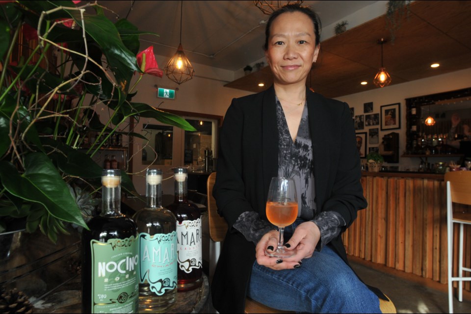 The Woods Spirits Co. owner Celia Chiang sits in her North Vancouver distillery and tasting room. | Paul McGrath / North Shore News 