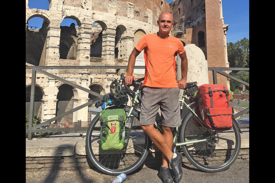 North Vancouver resident Jacek Laszkiewicz takes a break in Rome at the end of his six-month cycling trip in 2018. Laszkiewicz was recently recognized by Guinness World Records for his trip, where he set the record for the most consecutive capital cities visited by bicycle.