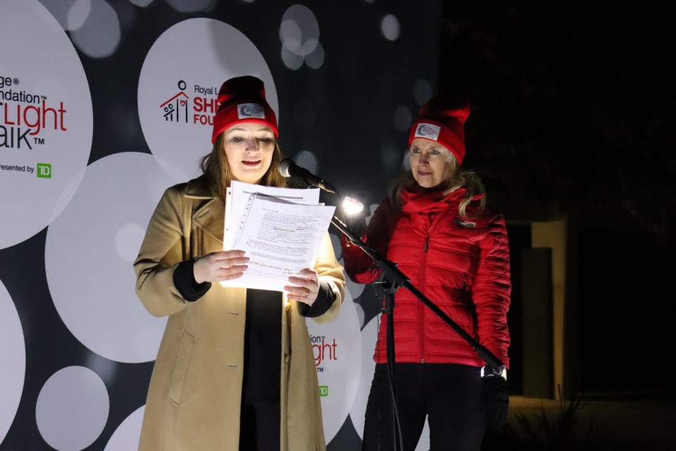 MC Brooklyn Driediger and Night Light Walk organizer Caroline Baile speak to the audience about the impact donations make for people affected by intimate partner violence. 