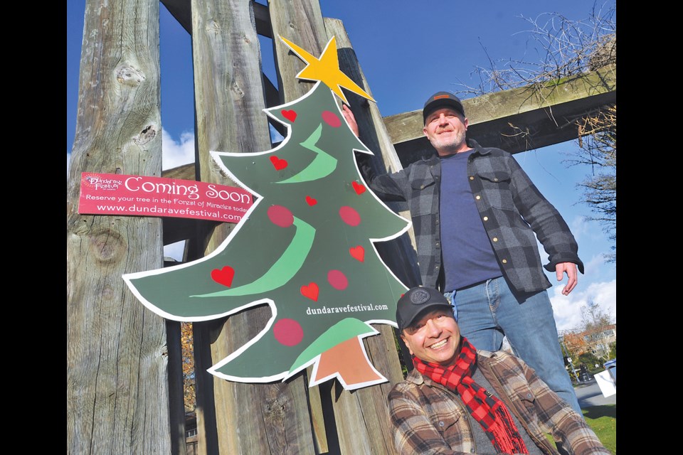 Dundarave Festival of Lights founder Michael Markwick and Lookout Society North Shore Shelter community liaison co-ordinator Owen Hynes look forward to the upcoming Forest of Miracles at the Dundarave Festival of Lights. | Paul McGrath / North Shore News