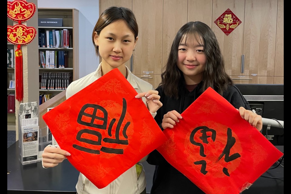 Volunteers at the West Vancouver Memorial Library help set up the building in preparation for Lunar New Year. | West Vancouver Memorial Library