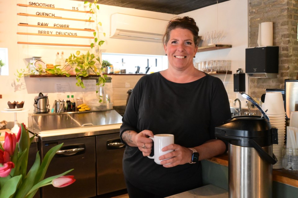 Iris Blanchett is all smiles serving coffee and sweet treats to customers again nearly four months after an atmospheric river hammered the North Shore. | Abby Luciano / North Shore News 