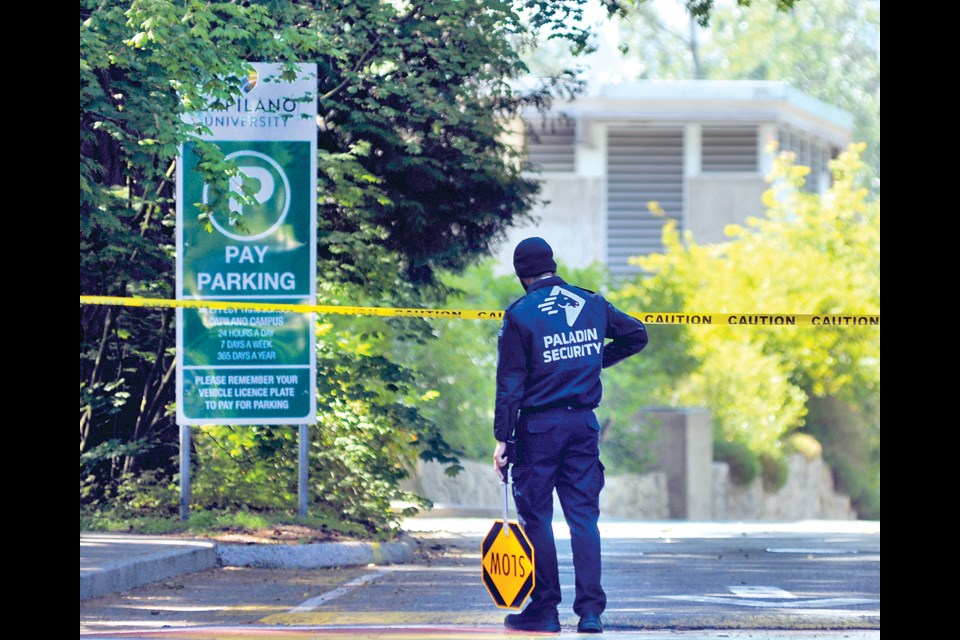 A security guard keeps watch at Capilano University's main North Vancouver campus on Friday, June 21, due to a reported threat of violence between students. The university's two North Van campuses were closed for three days, reopening on Monday, June 24. | Paul McGrath / North Shore News