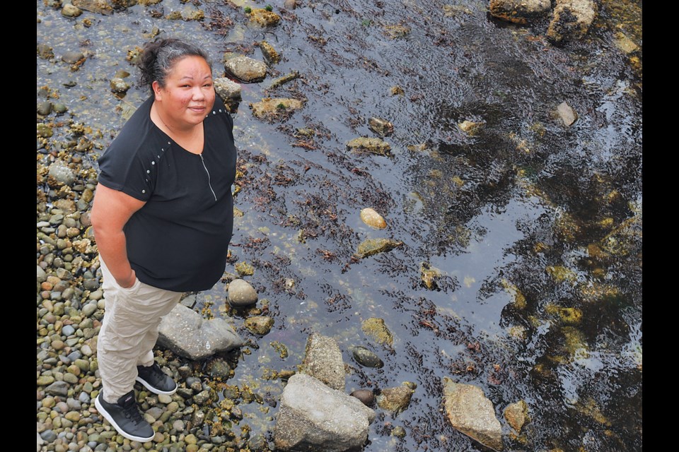 Tsleil-Waututh Nation member Michelle George stands on the Burrard Inlet waterfront that has provided nutrition for uncountable generations . | Paul McGrath / North Shore ߣ
