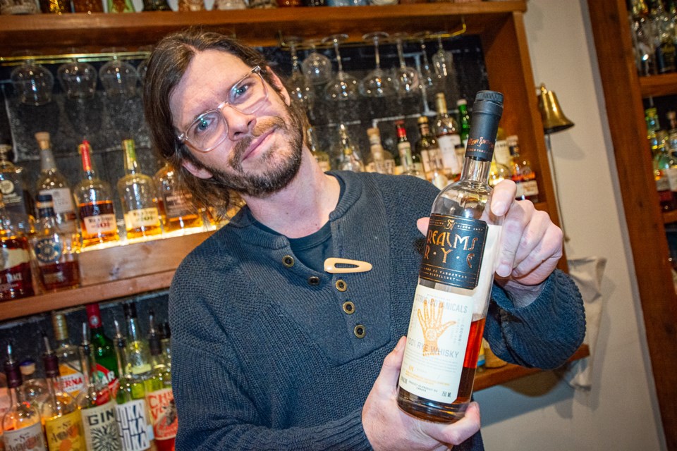 Distillery partner and general manager James Lester boasts a bottle of Sons of Vancouver’s Realms of Rye Release No. 01 ‘Citrus & Botanicals.’ It won Rye Whisky of the Year at the 2025 Canadian Whisky Awards. | Nick  Laba / North Shore News