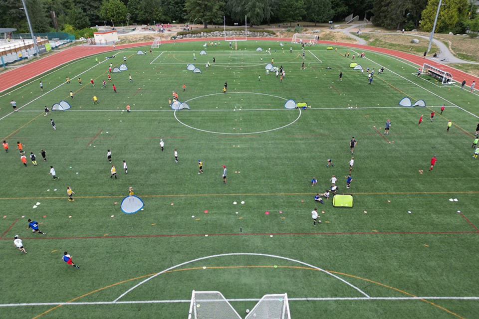 Dozens of NVFC players in multiple groups practice on one pitch at Fen Burdett Stadium in North Vancouver. There's a desperate need for more turf space for soccer players in North Van, says NVFC president Stuart Ince. | NVFC