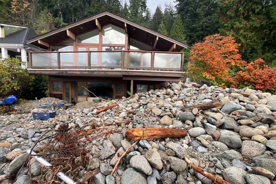 Debris flushed down during the atmospheric river storm of Oct. 18-20 sits strewn about near several Deep Cove properties. An evacuation order was issued for three homes Oct. 26 due to more debris falling from clogged creek systems above. | photo supplied