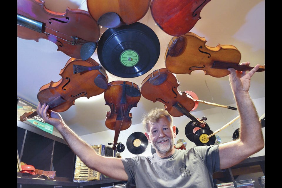 Urban Repurpose's Tom Reissner shows off a chandelier made of violins and records. The non-profit is hosting a Re-Use It & Upcycle Fair to showcase how old materials can be put to use again creatively. |
Paul McGrath / North Shore News 