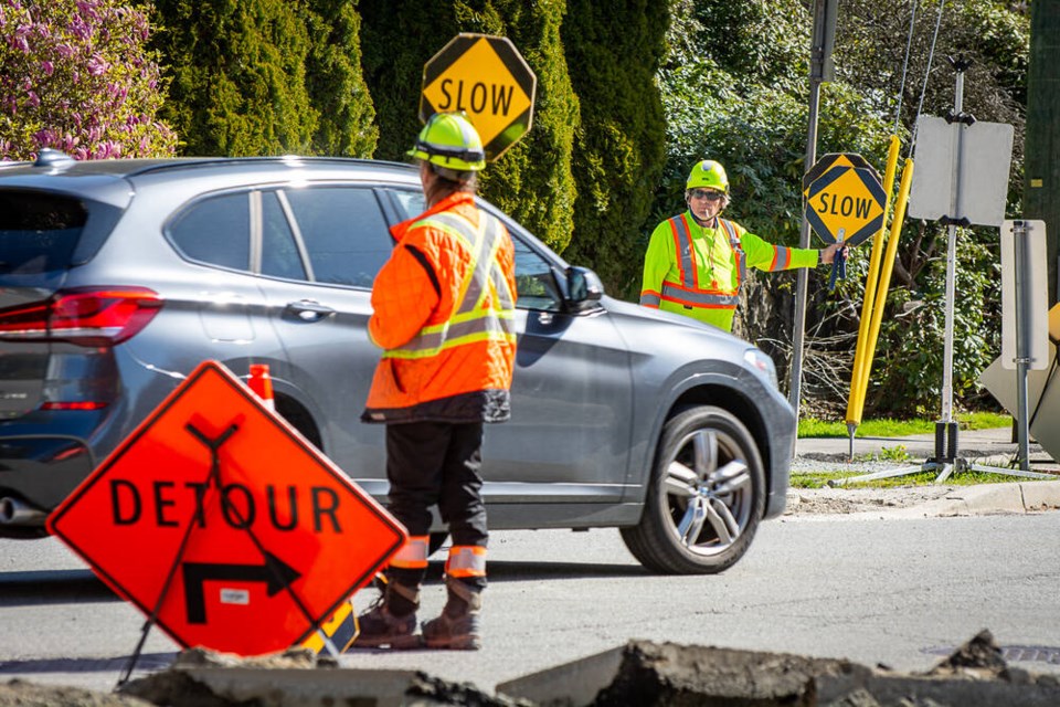 web1_24-4-19-construction-directing-traffic