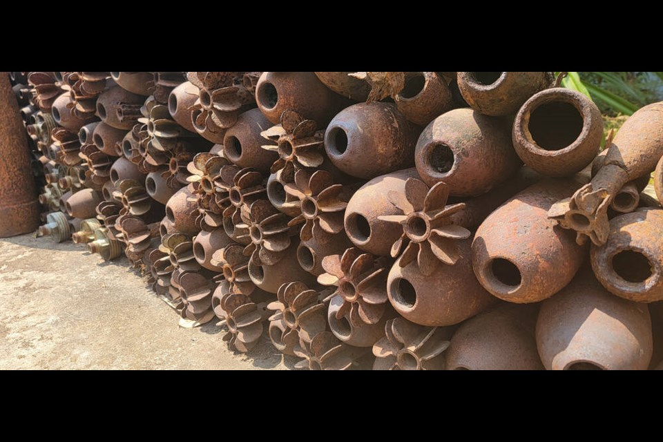 The shells of deactivated explosives remain outside the Cambodian Mine Action Centre. | Courtesy of Hatfield Consultants 
