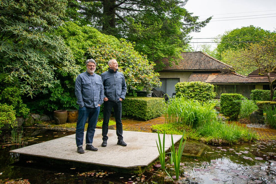 Arthur Erickson Foundation directors Clinton Cuddington and Brian Broster look out over the pond in the garden of Arthur Erickson’s former Vancouver home. | Nick Laba / North Shore ӣƵ 