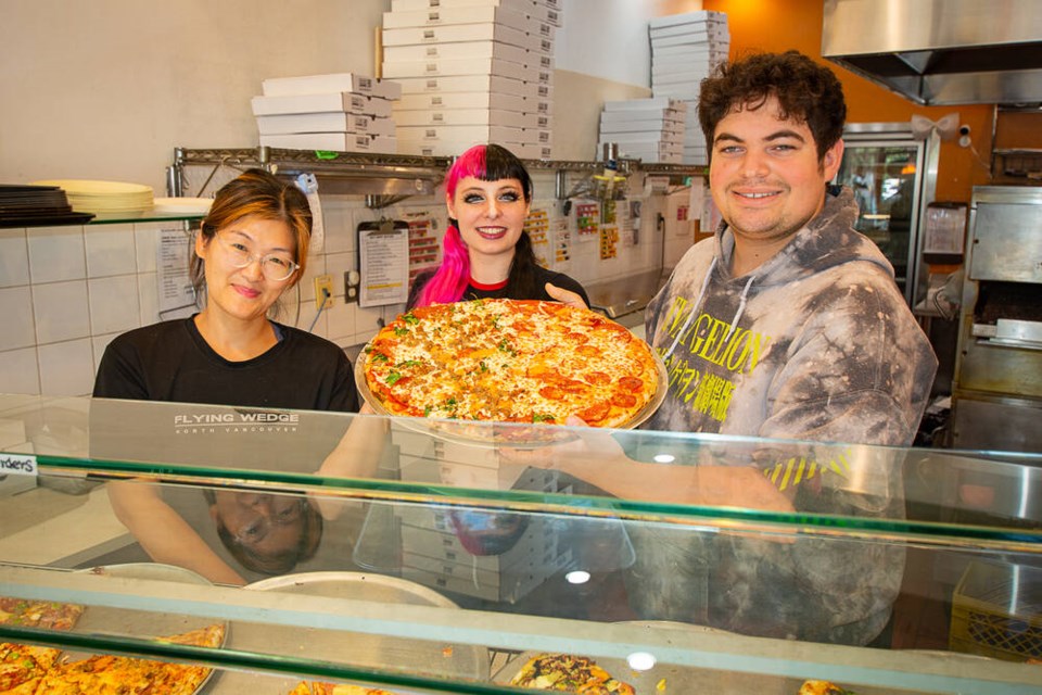 Store manager Lynn Liu, seven-year employee Ocian Hombach and eight-year employee Adrian Lockwood all describe the North Vancouver Flying Wedge Pizza as a positive place to work. | Nick Laba / North Shore News 