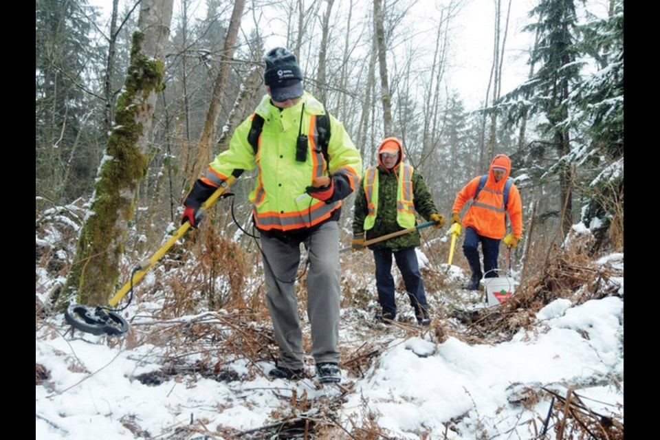 Explosives technician Bob Canning leads a survey crew equipped with metal detectors through the former Blair Rifle Range lands in Seymour, Feb. 2018. | file photo Mike Wakefield / North Shore News 