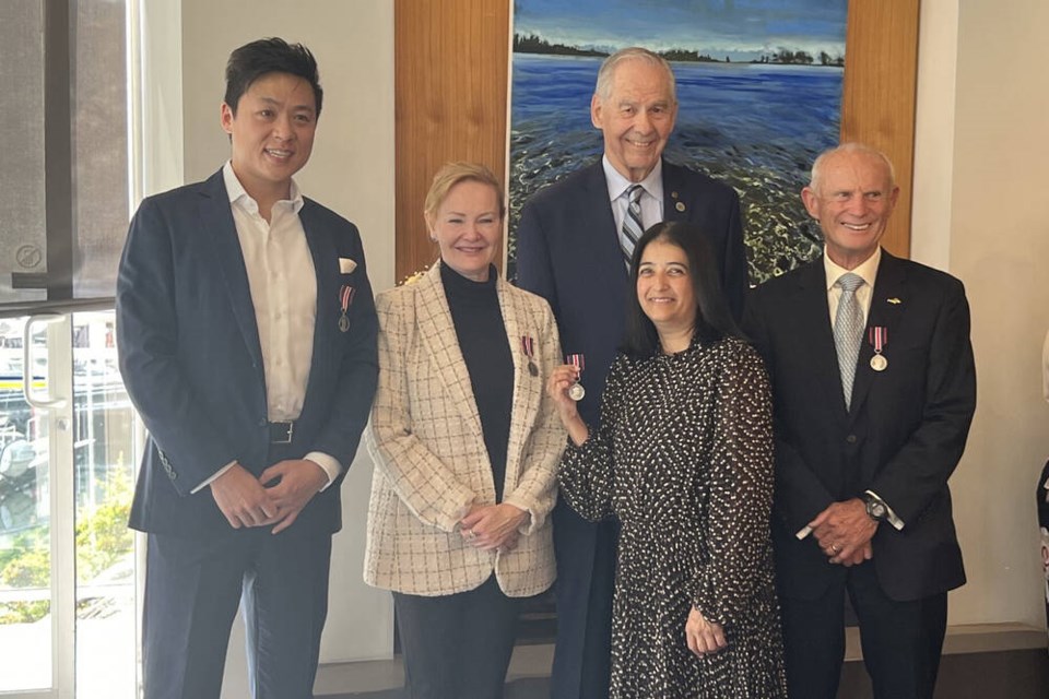 West Vancouver-Capilano MLA Karin Kirkpatrick (white blazer) presents Coronation Medals to Yang Wang, Jack McKee, John Barker and Kulvir Mann (front). | Jaya Mann 