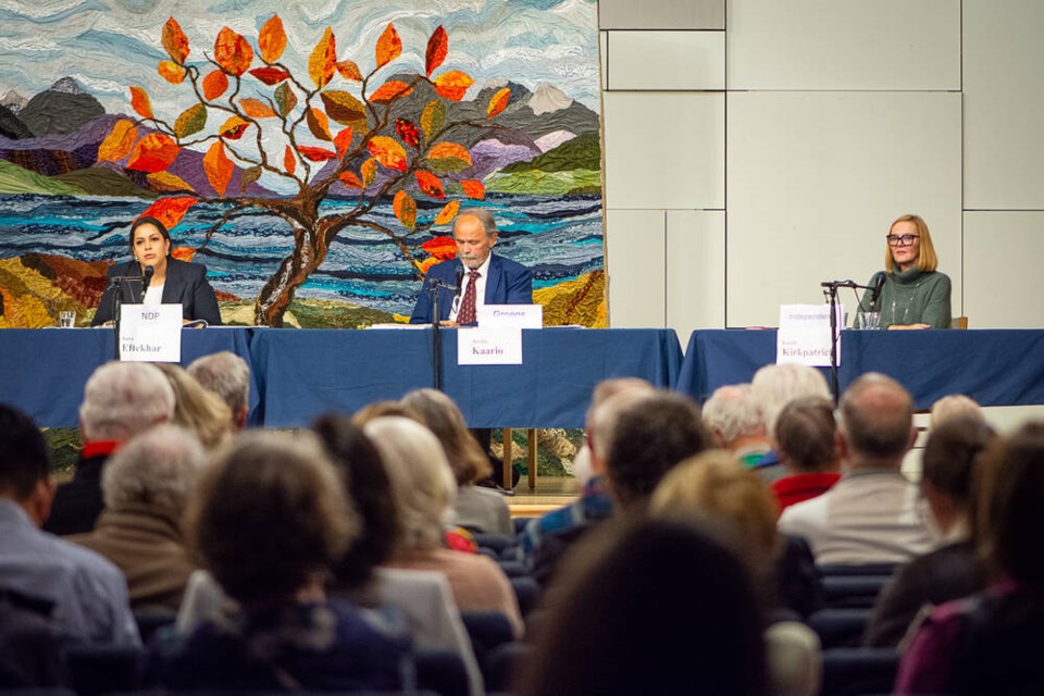 Three West Vancouver-Capilano MLA candidates sit behind microphones on the stage at Uplands United Church on Wednesday evening: Sara Eftekhar of the BC NDP, Archie Kaario of the BC Greens, and independent Karin Kirkpatrick. | Nick Laba / North Shore News