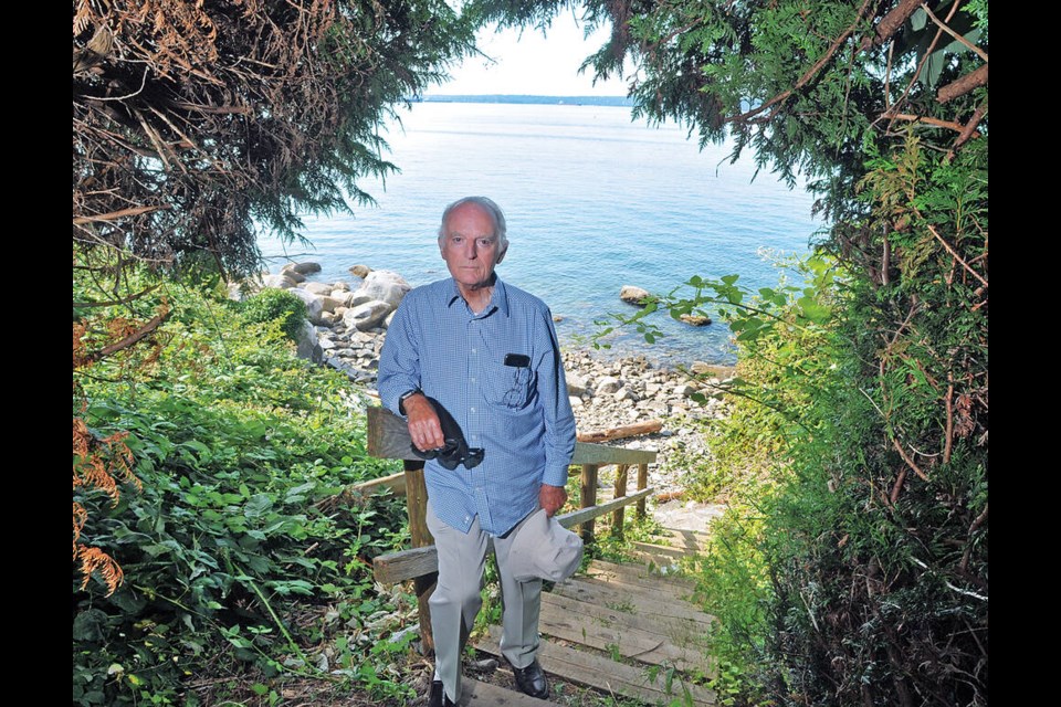 West Vancouver resident Peter Miller stands on an Altamont beach access trail, which will soon be sold to a private buyer. | Paul McGrath / North Shore News 