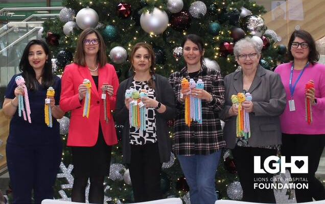 Crochet club member Shadi Sadeghi, Lions Gate Hospital Foundation vice-president Louise Campbell, St. Andrew's United Church Crochet Club co-ordinator and church mission team chair Mehrnaz Mozaffarian, crochet club member Vafa Vafaei, Minister at St. Andrews United Church Judith Hardcastle and LGHF event manager Pegah Behnammoradi show off some jellyfish dolls at Lions Gate Hospital. | Lions Gate Hospital Foundation 