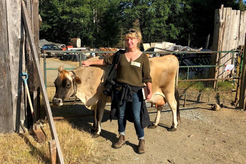 Making friends with a raw milk jersey cow at OUR Eco-village on Vancouver Island. | Courtesy of Laura Marie Neubert 