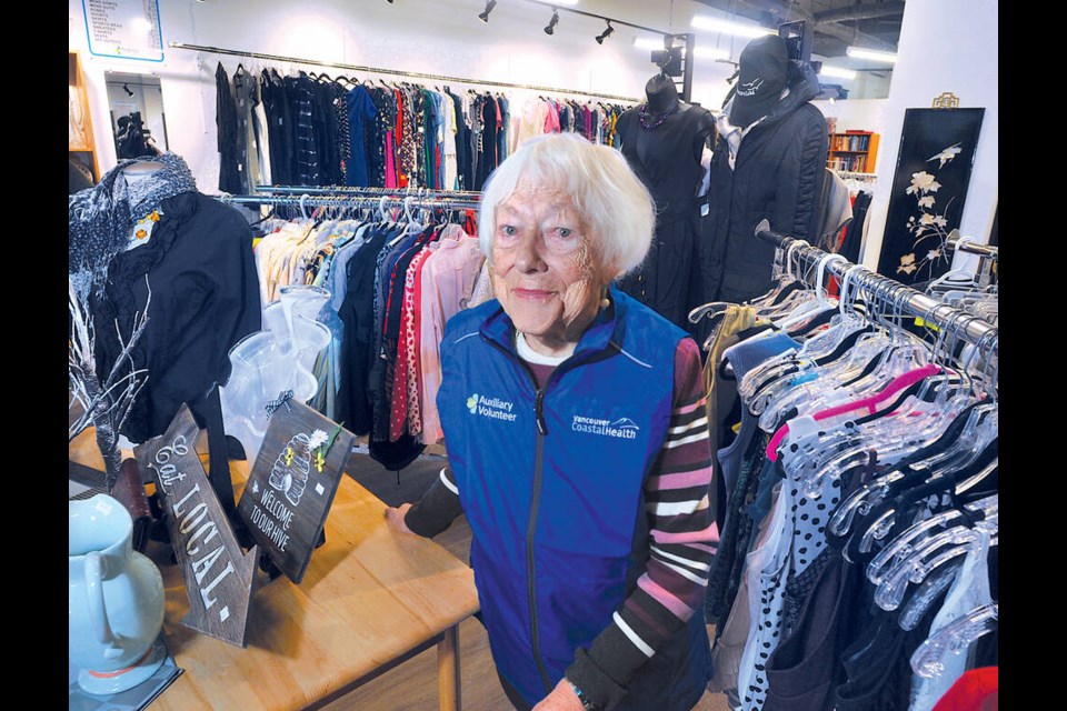 Long-time Lions Gate Hospital Auxiliary Thrift Shop volunteer, 93-year-old Helen Galan, is happy to see the shop up and running at its new location at 132 16th St. West in North Vancouver. | Paul McGrath / North Shore News 