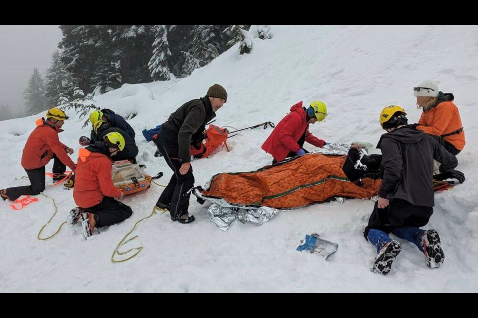 North Shore Rescue members respond to a call of a man who broke his leg sliding down Hollyburn Mountain Trail early Monday afternoon – marking the second such call the search and rescue team has seen in two days. | North Shore Rescue / Facebook 