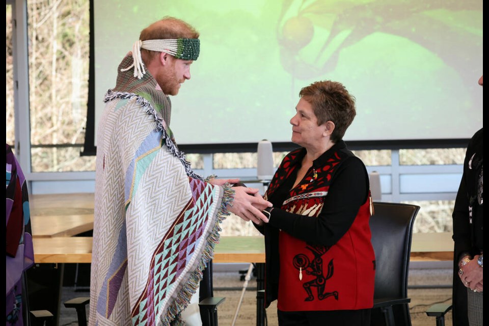 Prince Harry meets with Tsleil-Waututh Nation elected Chief Jen Thomas during a royal visit on Valentine's Day. The Duke of Sussex was gifted a traditional blanket during the event. | Eric Charbonneau