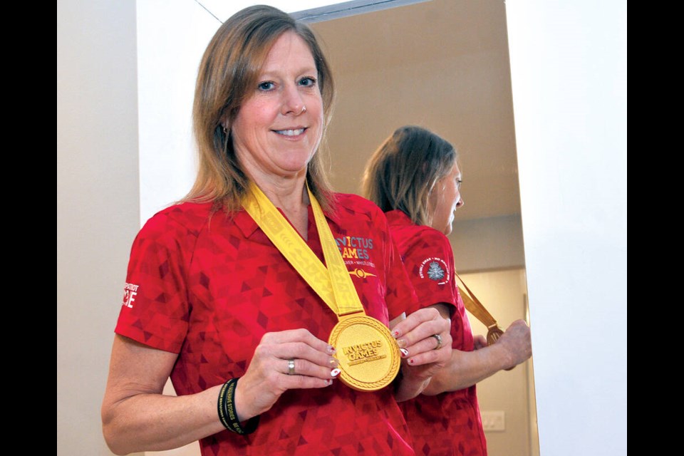 North Vancouver war veteran Assunta Aquino dons the gold medal won in downhill skiing at the 2025 Invictus Games in Vancouver and Whistler. | Paul McGrath / North Shore News North Vancouver war veteran Assunta Aquino dons the gold medal won in downhill skiing at the 2025 Invictus Games in Vancouver and Whistler. | Paul McGrath / North Shore News 