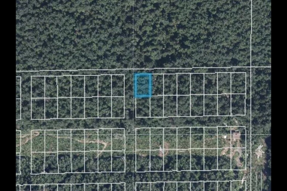 A map with drawn property boundaries shows Indian River Drive Lot 1, highlighted in blue. | Zillow.com 