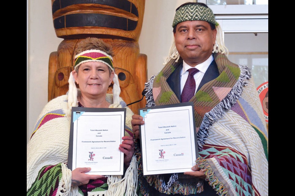 Tsleil-Waituth Nation Elected Chief Jen Thomas and Honourable Gary Anandasangaree, Minister of Crown-Indigenous Relations and Northern Affairs, sign a new reconciliation agreement on Friday, March 7 at the Nation's community centre. | Paul McGrath / North Shore News 