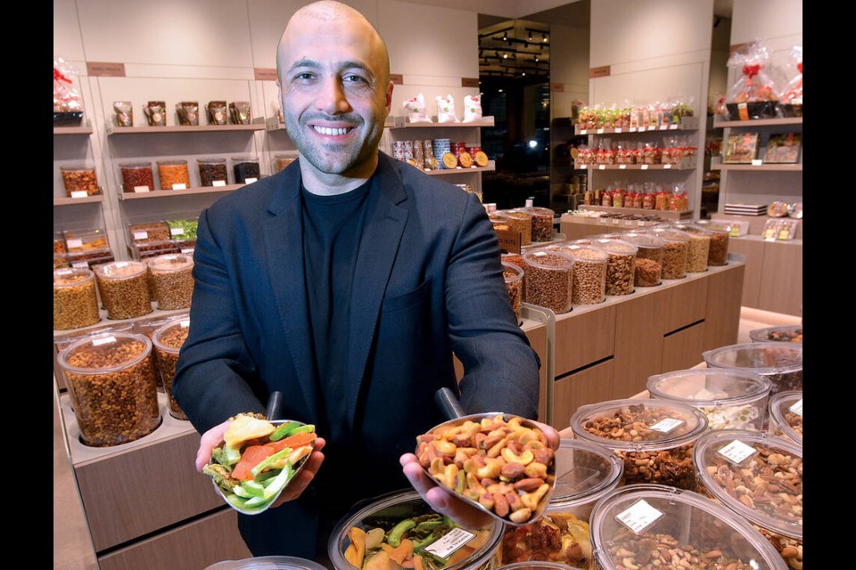 Amir Hosh, owner of Ayoub’s Dried Fruits & Nuts, at the recently opened store in Park Royal South. | Paul McGrath / North Shore News 