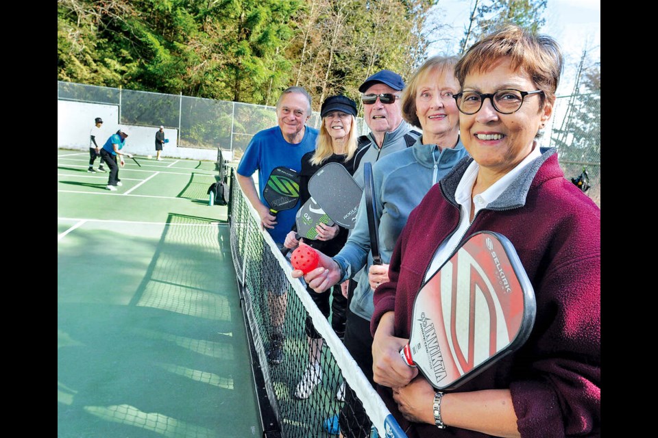 West Vancouver pickleball players Ed Pielak, Diane Cardwell, Reg Allen, Ellen Forshaw and Kay Keshavjee celebrate new courts at Ambleside Park. | Paul McGrath / North Shore News 