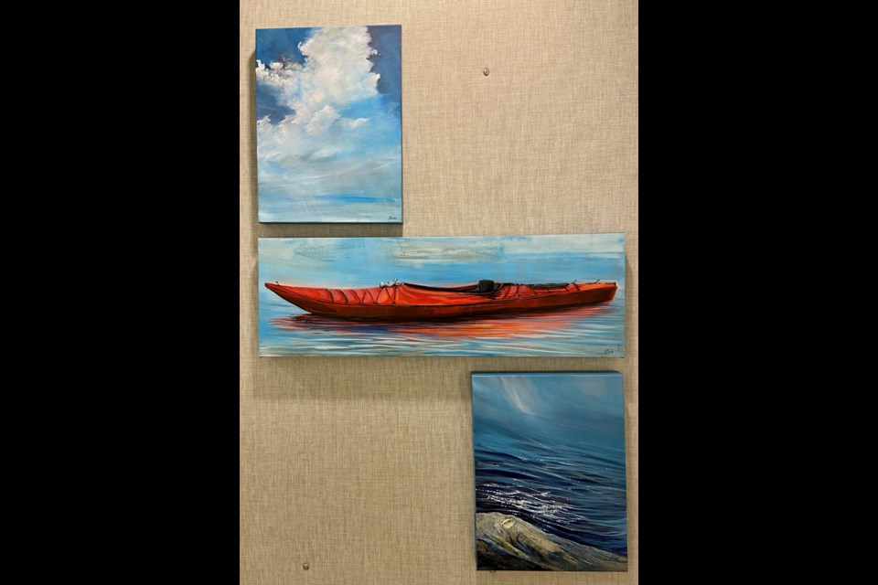 The three water and sky-based paintings: Every Breath We Take, Better Together, and Full to the Brim, by Jennifer Caie.