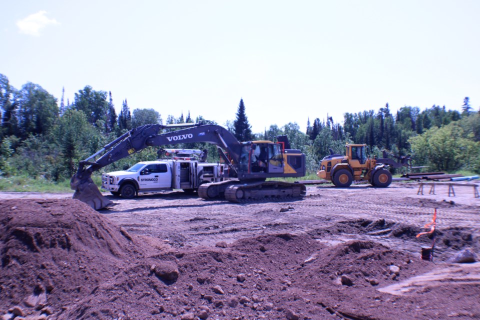 Excavators working on the Mercury Street culvert. (Clint Fleury, NWOnewswatch.com)