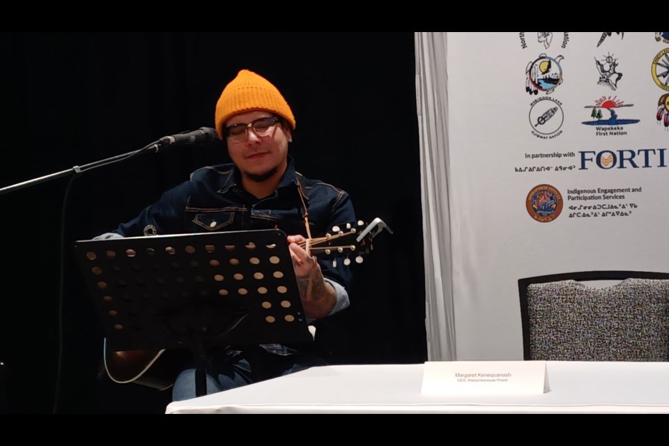 Musician Nick Sherman, from North Caribou Lake First Nation, performs Dec. 11, 2024, in Thunder Bay during a celebration of the Watay power line's completion.