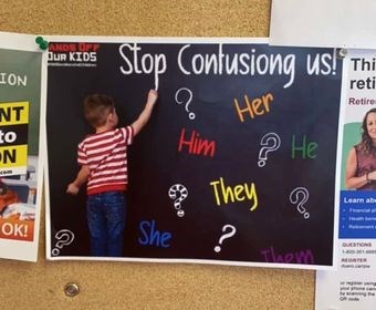 photograph from the parental rights advocate group “Hands Off Our Kids” that depicts a school-age child surrounded by pronouns and a caption that says, “Stop Confusing Us!” (Photo submitted by Borderland Pride)