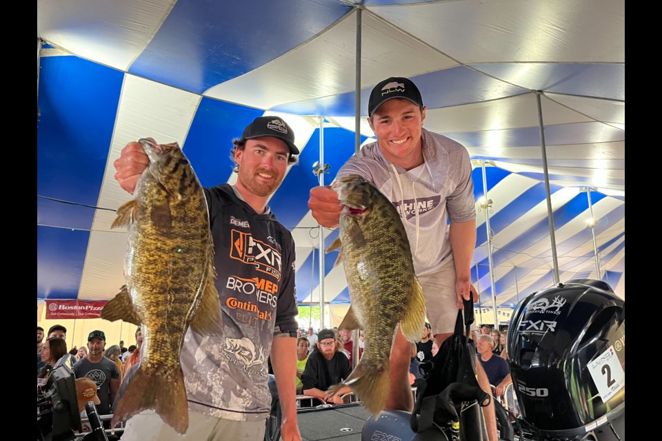 Motei Demers, left, and Ian Waterer show off some of the bass they caught during the final day of the 2024 Fort Frances Canadian Bass Championship. 