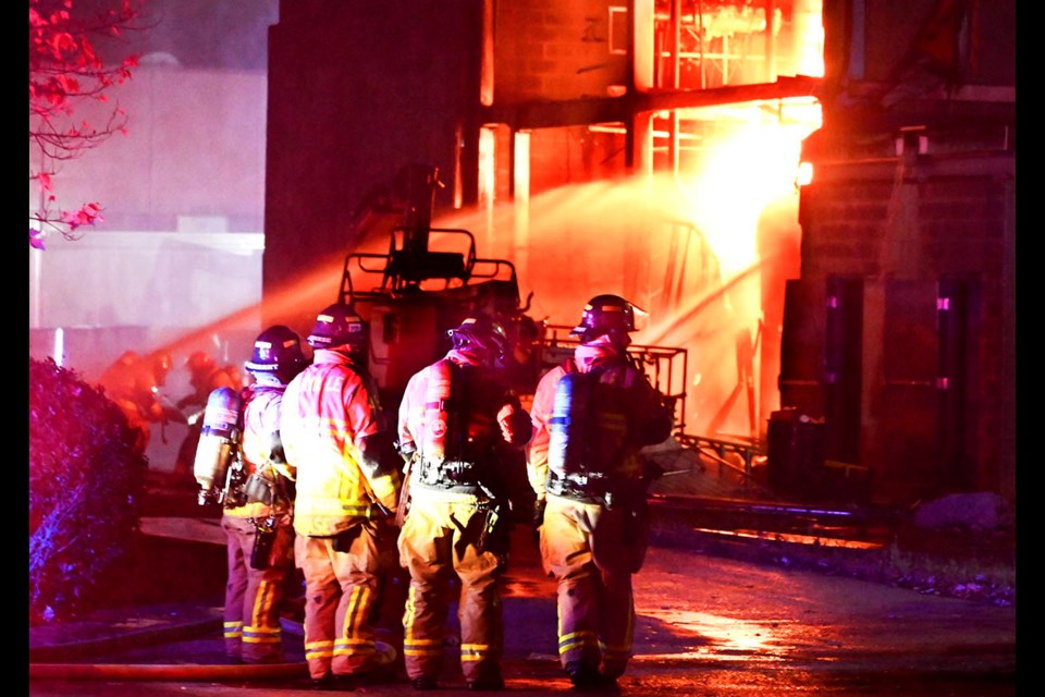 Oakville firefighters battled heavy fire at the rear of a large food manufacturing plant late Tuesday night.