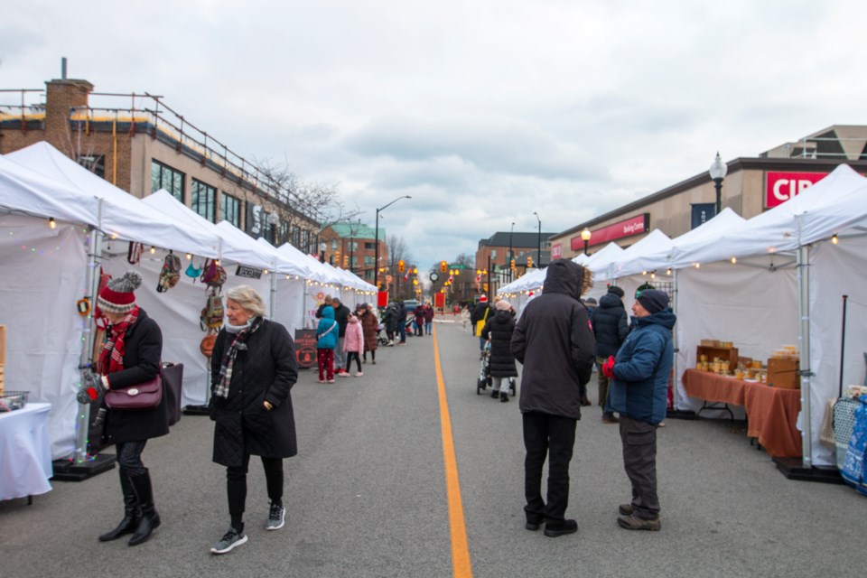 Market goers attend the holiday market in downtown Oakville.