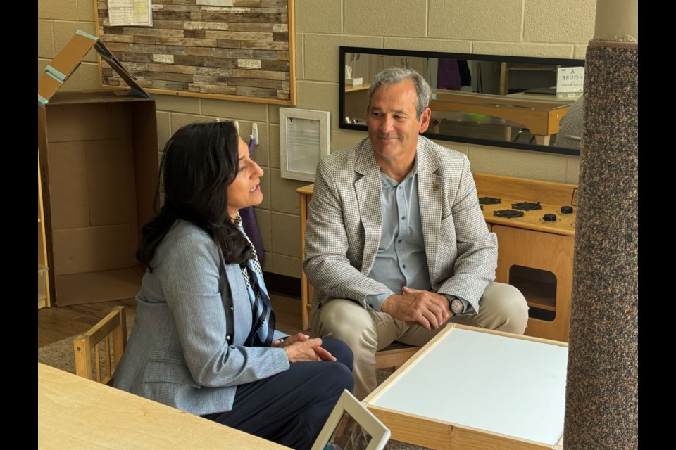 Minister Anand at Oakville Trafalgar High School in the YMCA Child Care centre