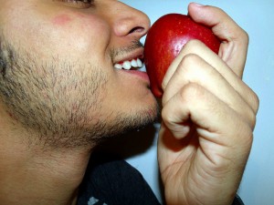 Man smelling an apple