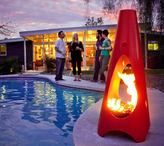 Chiminea lit by a pool