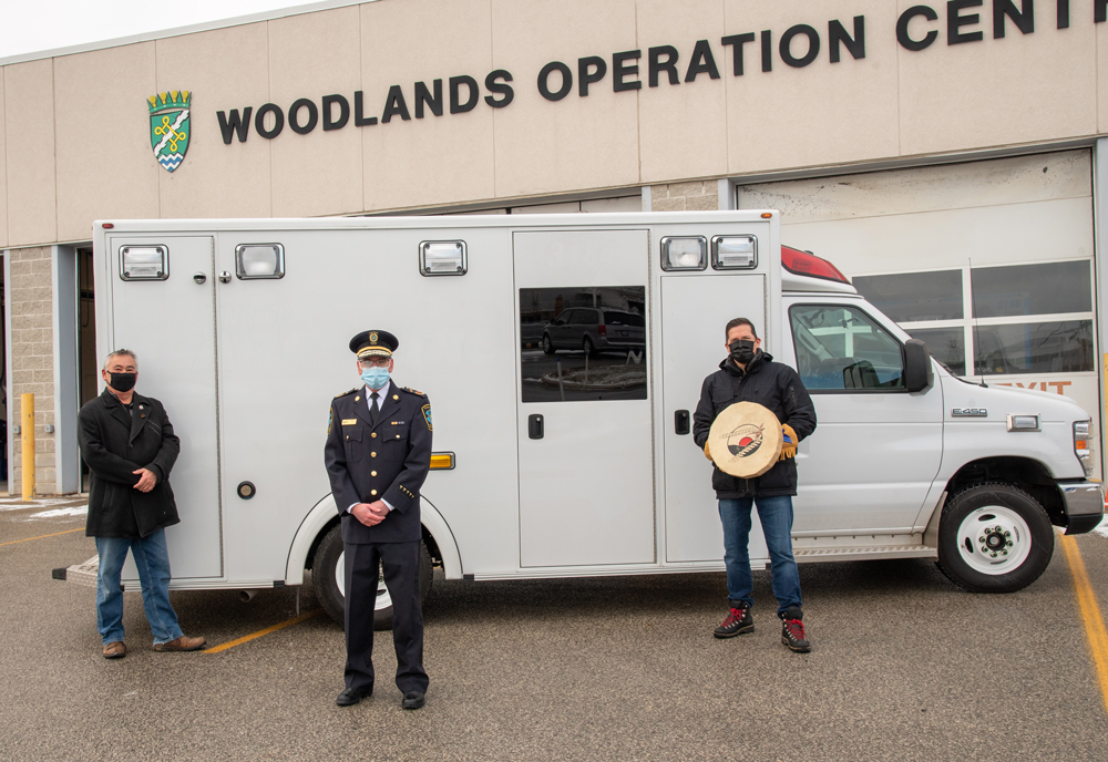 From left to right: Local Indigenous Knowledge Keeper Stephen Paquette, Paramedic Services Chief Greg Sage and Halton Region’s Indigenous Advisor Eddy Robinson with the decommissioned ambulance that was donated to the Kenora Chiefs Advisory on December 17, 2020 at Woodlands Operations Centre. | Halton Region