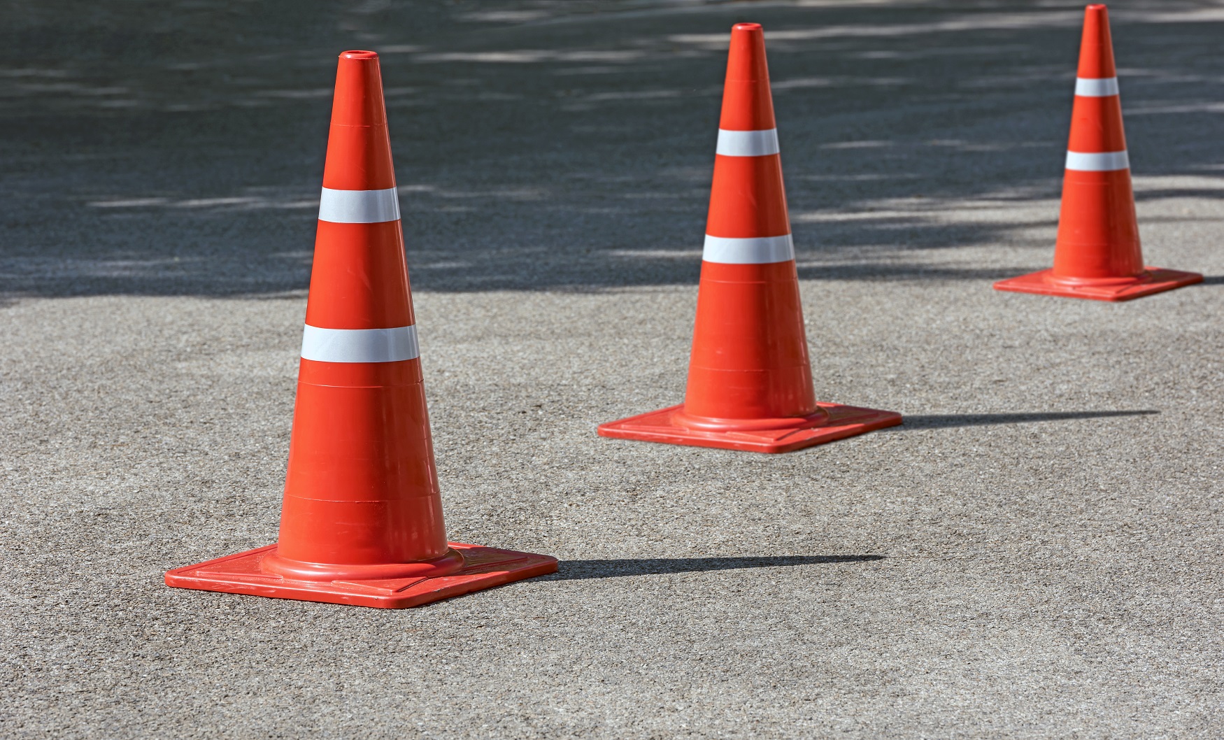 bright orange traffic cones standing in a row on the road | Town of Oakville