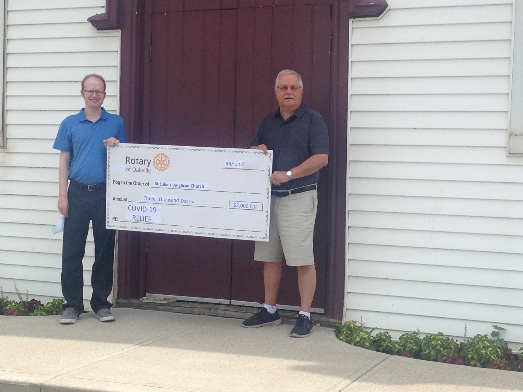 Oakville Rotary raises money | Mike Henry (right) presenting a cheque to Roy Campbell (Left)