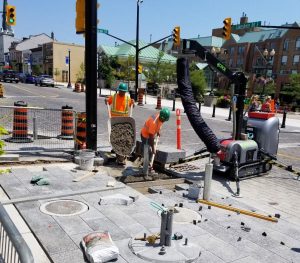 Downtown reconstruction |  Installation of new granite pavers is underway.