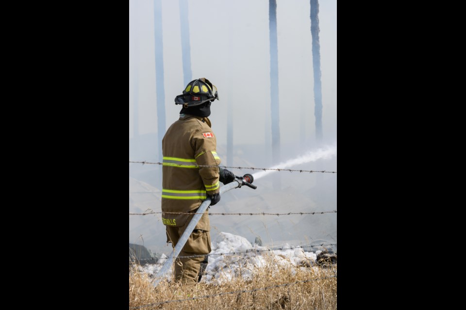 A fire broke out in a hay storage building on Hwy 522 W, northwest of Okotoks on Tuesday, March 22, 2022. Multiple crews responded and found the structure fully involved on arrival. A cause of the fire has not been determined yet. 