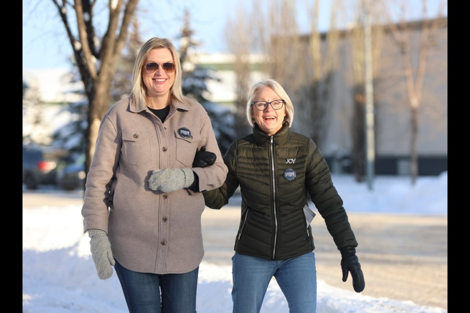 Lori and Lynda Clayson make their way along Community Way for the Coldest Night of the Year walk in Okotoks on Feb. 25. Hosted by Baby It's Cold Outside, the walk had 93 participants and raised nearly $13,000 for local charities supporting the less fortunate.