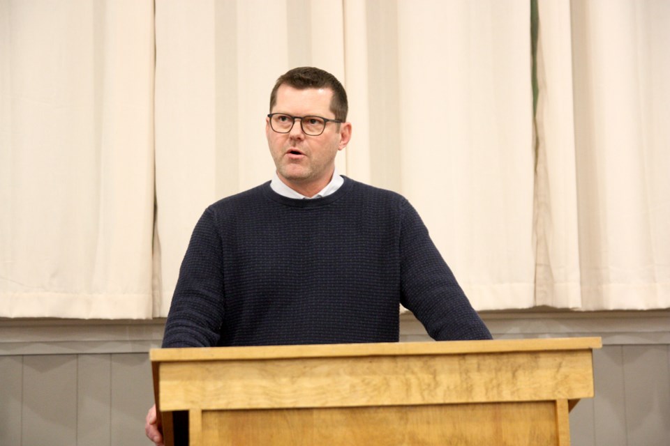 Highwood MLA and parliamentary secretary for EMS RJ Sigurdson speaks to a crowd during a town hall at the Okotoks Elks Hall Feb. 21. 