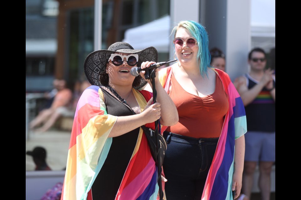 Foothills Rainbow Collective founder Marissa Angel Johnston speaks at the Okotoks Municipal Centre on June 4, 2023 for Pride Month. 