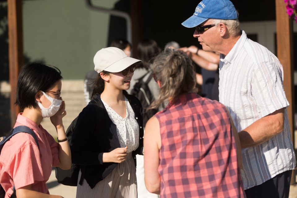 (L-R) Yuki Sakurai and Yuki Sakurai, students of the Konan Girls School in Kobe, Japan meet Okotoks residents Lori Davies and Brian Klaver, who will be billeting them for the next two weeks on July 29.